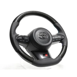 Volante de carbono negro GReddy con costura tricolor para Toyota Yaris GR GXPA16
